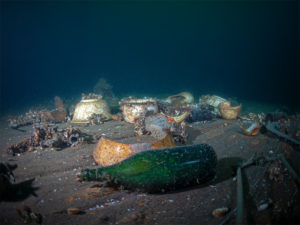 Bottles, dish ware and tools can be viewed on the deck of the Munson. Photo Jill Heinerth